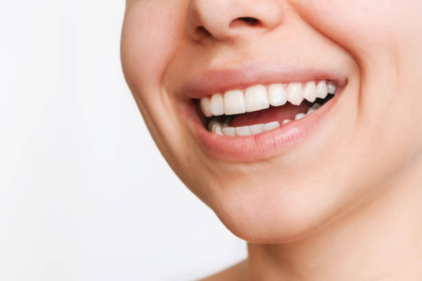 close-up shot of a woman's smile