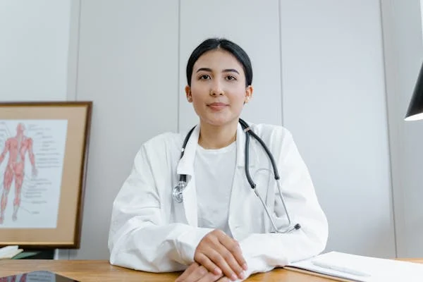image of a dental professional sitting behinf a desk