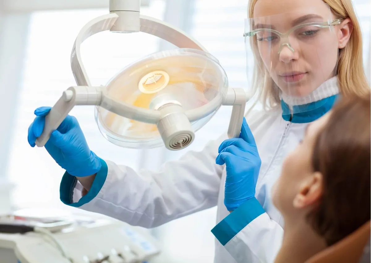 Dentist examining a patient for swollen gums and other signs of gum inflammation.